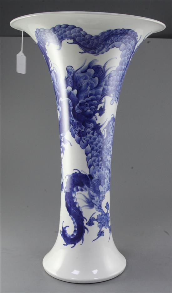 A large Japanese blue and white trumpet shaped vase, by Makuzu Kozan II (Miyagawa Hanzan, 1858-1940), 59.5cm, two hairline rim cracks